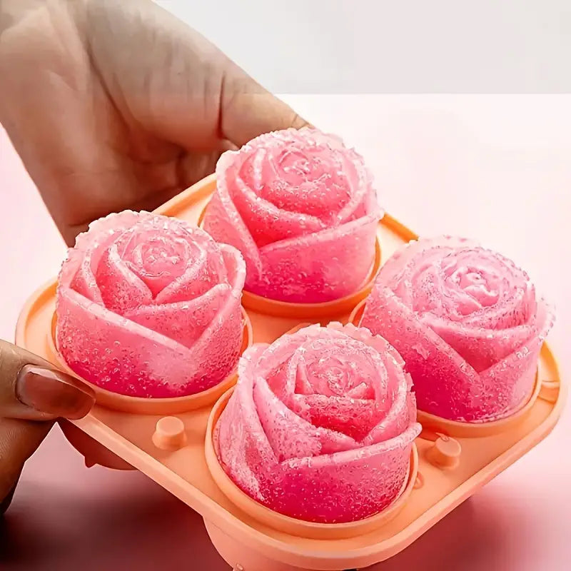 Hands holding sample of rose shaped ice cubes in mold.